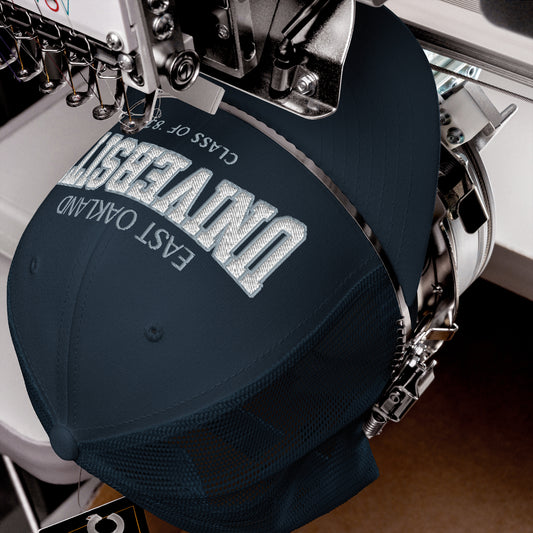 East Oakland University trucker cap with embroidered text.