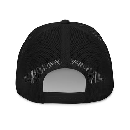 Black mesh back trucker cap with a flat brim and adjustable snap closure.