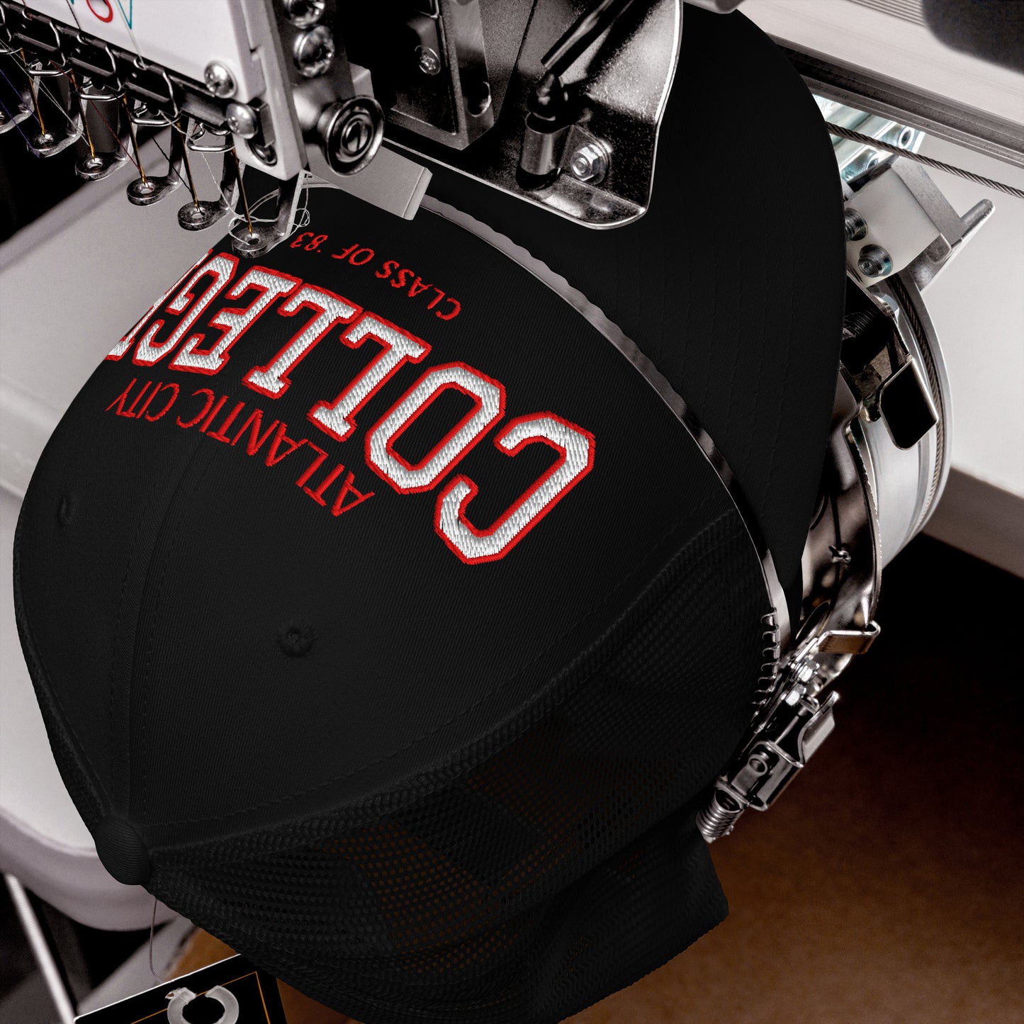 Black Atlantic City College trucker cap with red and white embroidery.