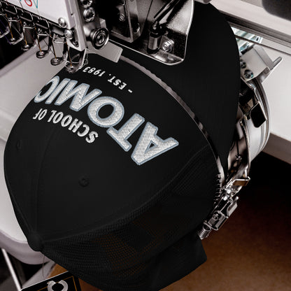 Black School Of Atomics trucker cap with embroidered text and mesh back.
