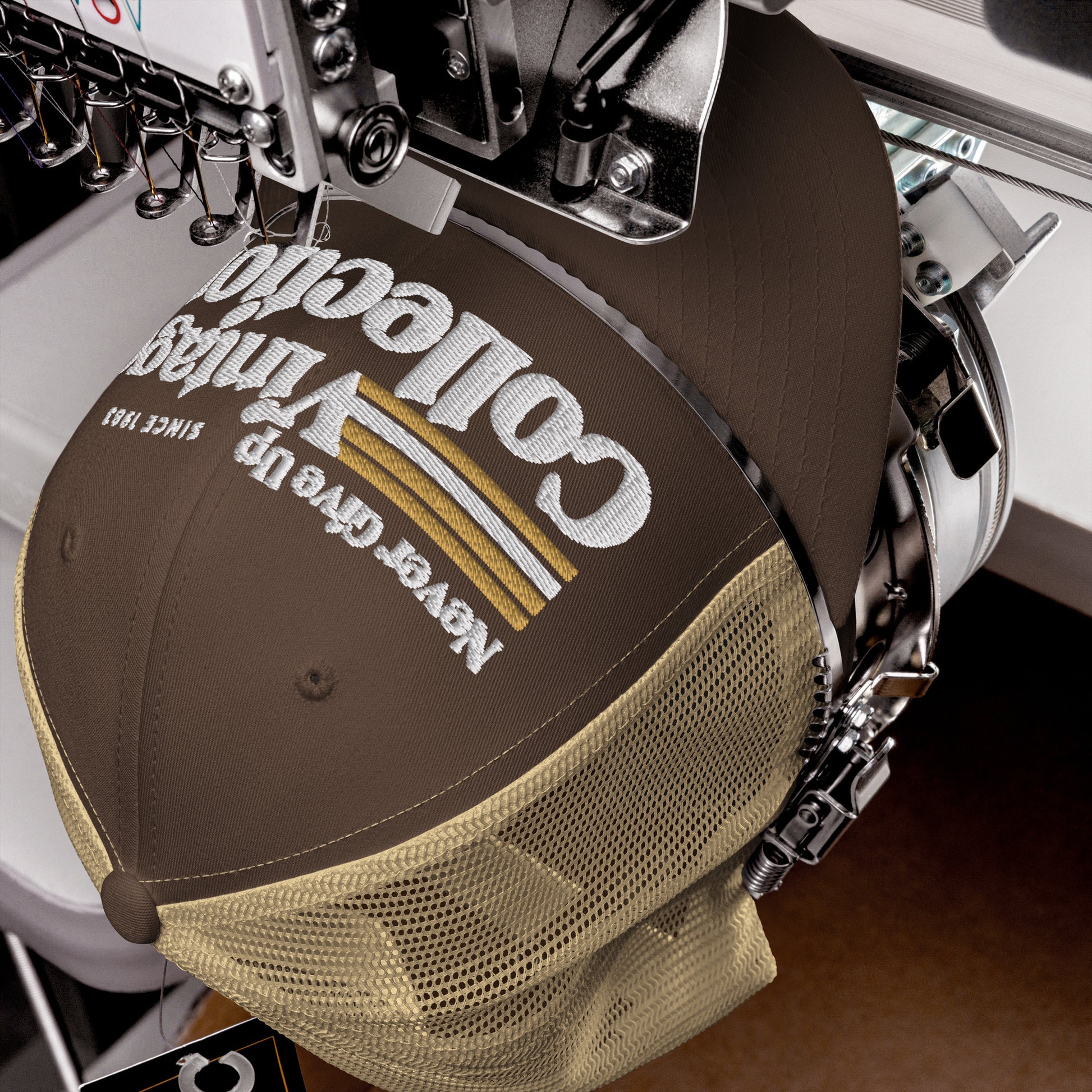 Retro Collection trucker cap with embroidered text and mesh back.