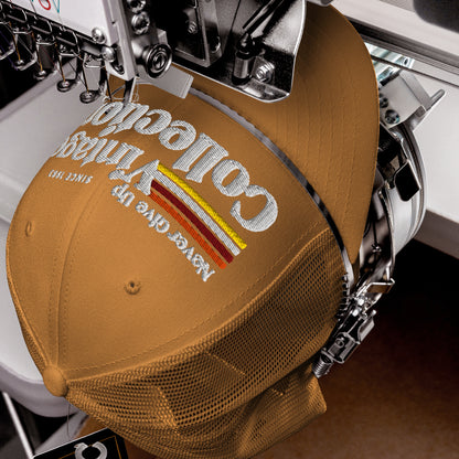 Retro Collection Trucker Cap with embroidered text and stripes.