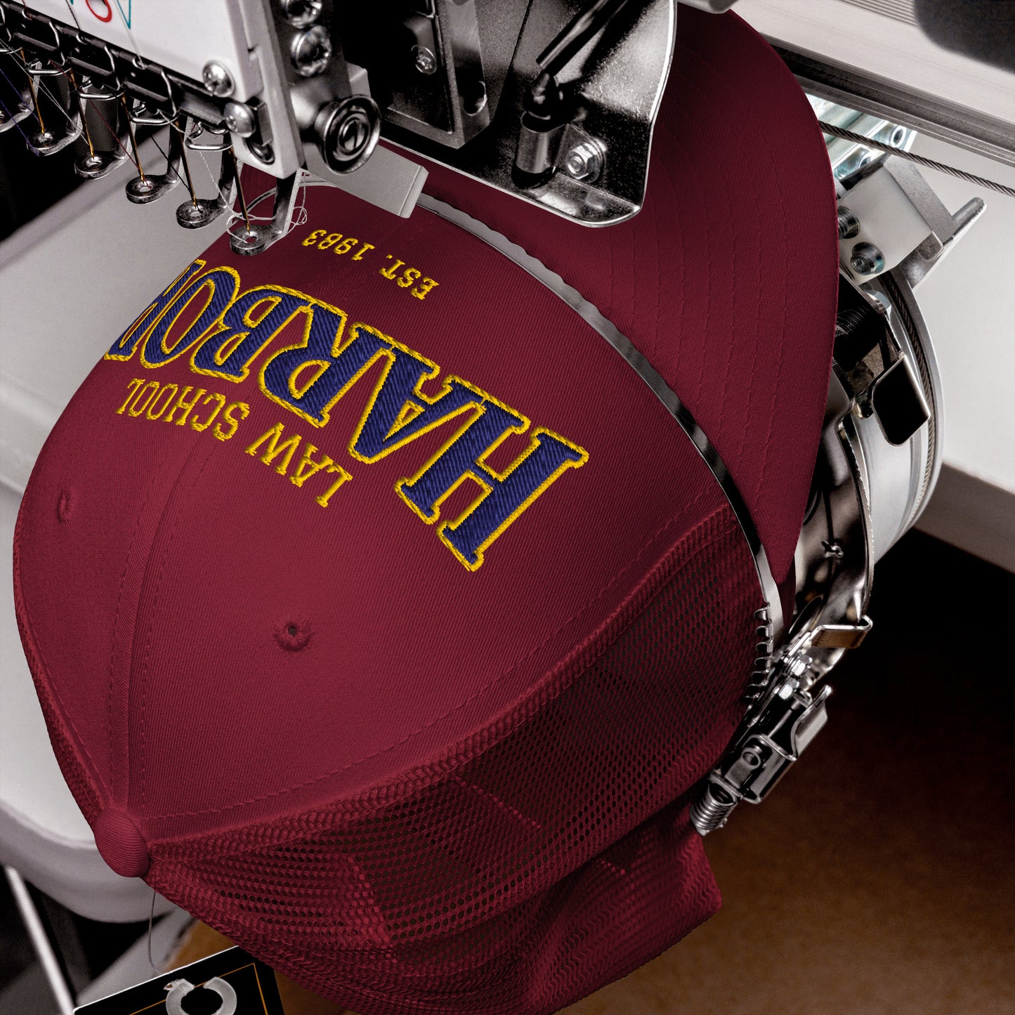 Maroon Harbor Law School trucker cap with embroidered text.