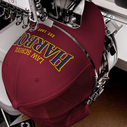 Maroon Harbor Law School trucker cap with embroidered text.
