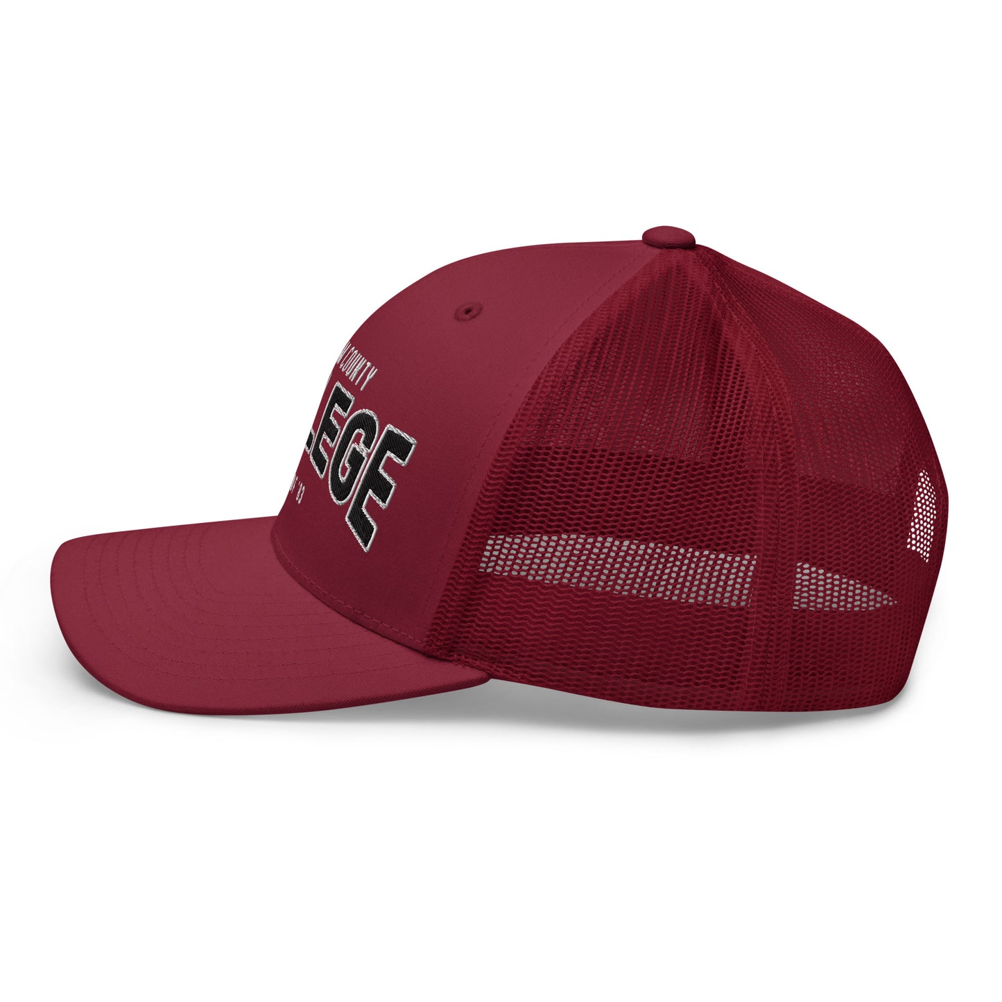 Freedom County College trucker cap in maroon with white lettering.