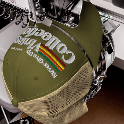 Retro Collection trucker cap with embroidered text and rainbow detail.