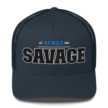 A navy blue trucker cap with "SAVAGE" and "EST. GO WILD 1963" embroidered on the front.