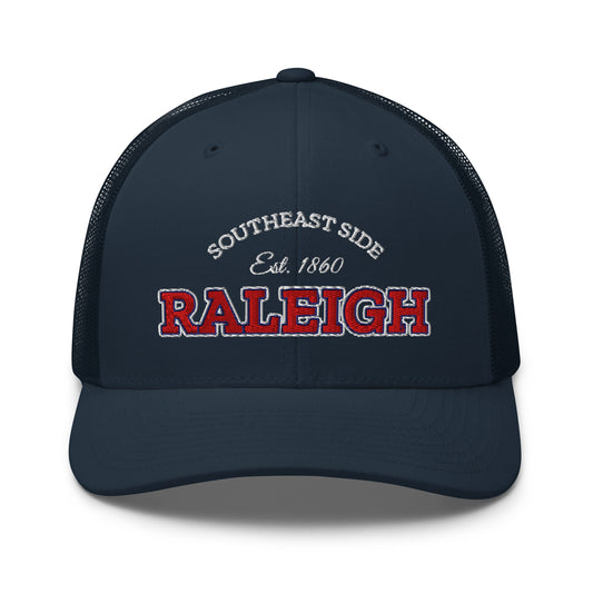 Navy blue trucker cap with "Raleigh" and "Southeast Side Est. 1860" embroidered on the front.