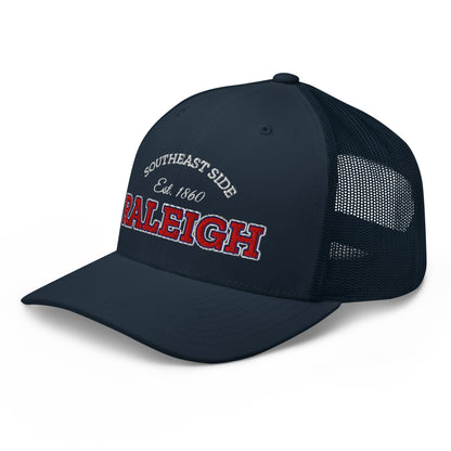 Navy blue trucker cap with "Southeast Side Est. 1860 Raleigh" embroidered on the front.