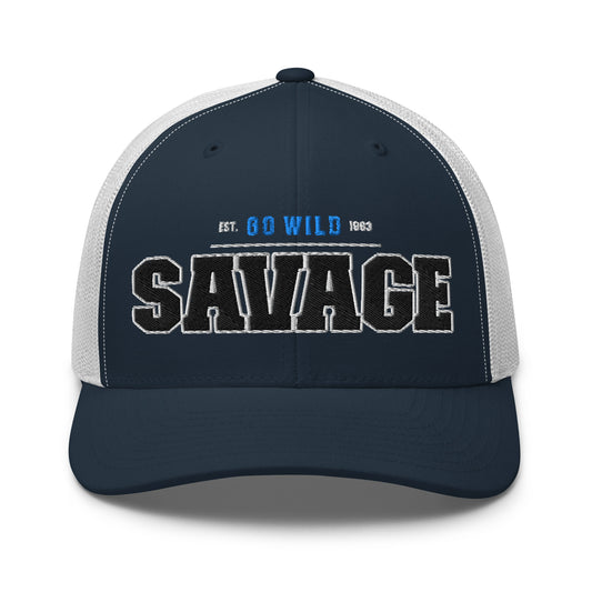 A navy blue trucker cap with white mesh back and "SAVAGE" embroidered on the front.