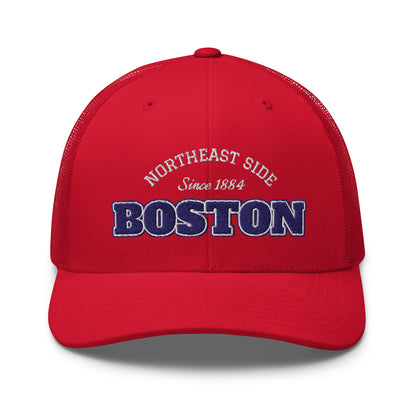 Red trucker cap with "Northeast Side Boston Since 1884" embroidered on the front.