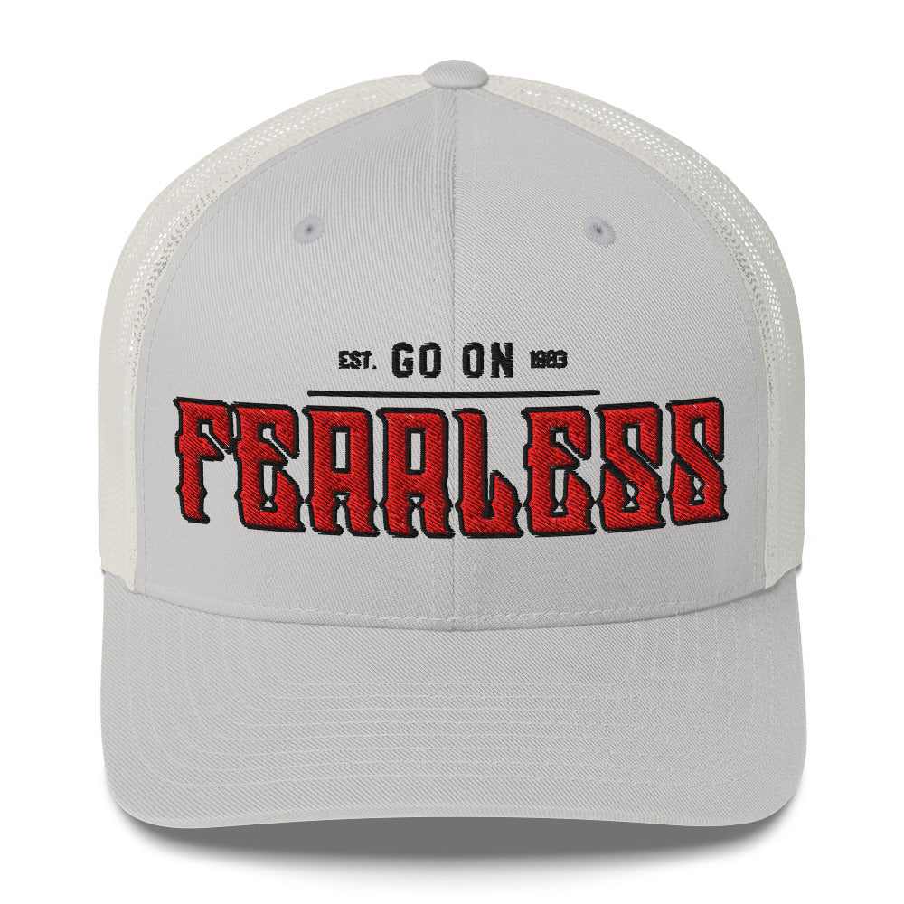 A light grey trucker cap with white mesh back and "FEARLESS" embroidered in red.