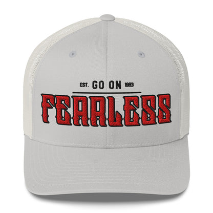 A light grey trucker cap with white mesh back and "FEARLESS" embroidered in red.