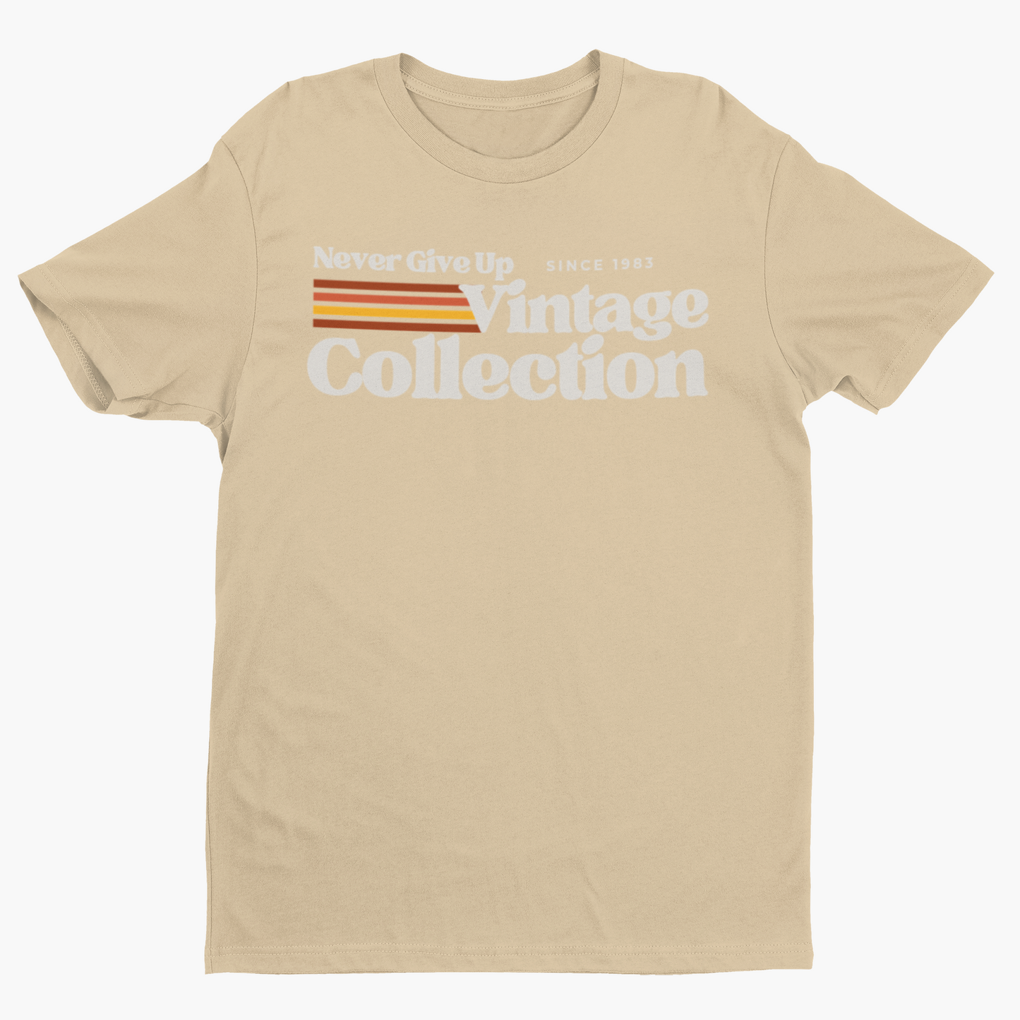 A tan t-shirt with "Never Give Up Vintage Collection Since 1983" printed on it.