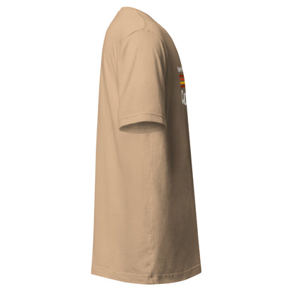 A tan t-shirt with a retro graphic on the chest.